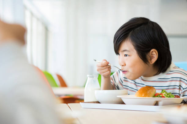 Elementary school lunch Elementary school lunch food elementary student healthy eating schoolboy stock pictures, royalty-free photos & images