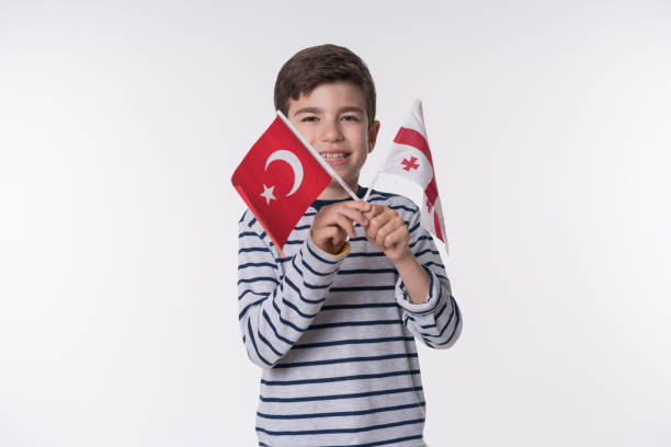 istock Little child with turkish and georgian flag 838134396