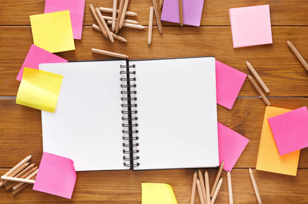 istock Top view of blank notepad on wooden office desk 838138248
