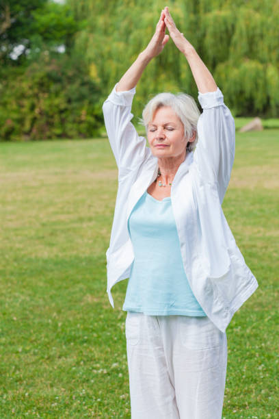 istock senior woman practicing yoga 838151812