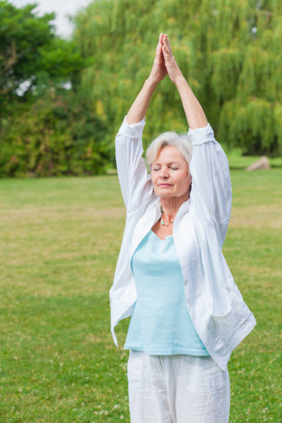 istock senior woman practicing yoga 838151878