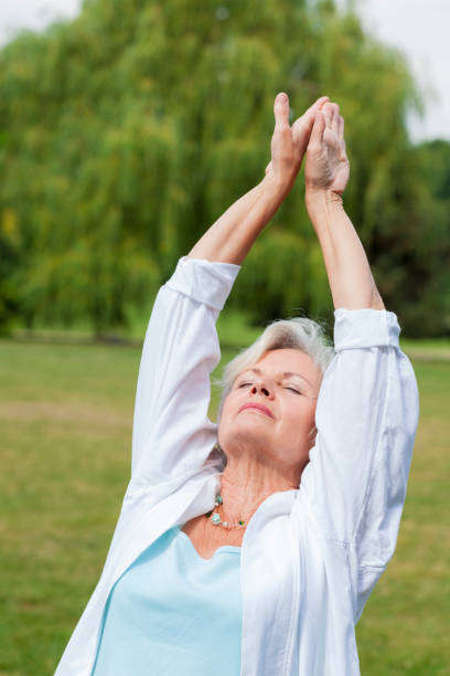 istock senior woman practicing yoga 838151926