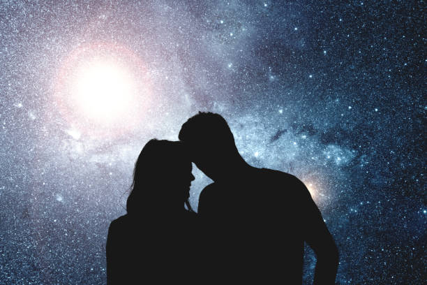 Silhouettes of a young couple under the starry sky. My astronomy work. Silhouettes of a young couple under the starry sky. My astronomy work. stars in your eyes stock pictures, royalty-free photos & images