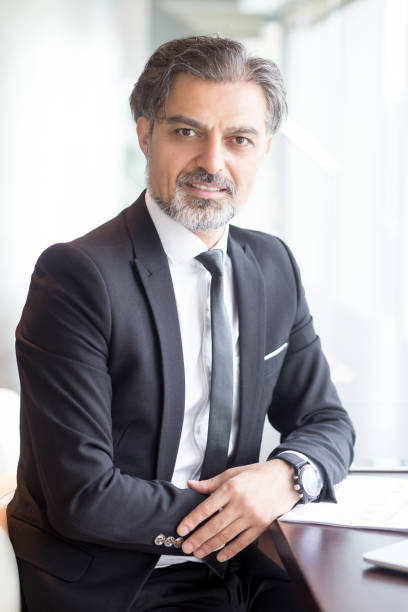 istock Confident Business Leader Sitting at Table 838164346