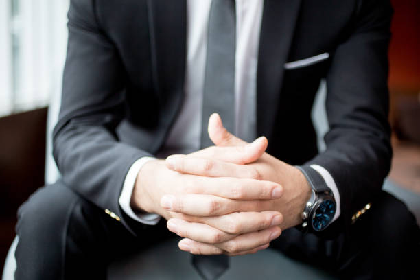 istock Cropped View of Businessman Clasped Hands 838164348