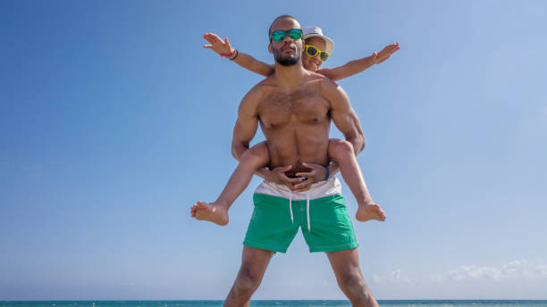 istock Father and daughter on the resort hotel beach 838172612