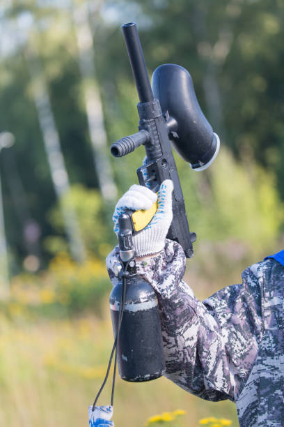 istock Paintball weapon in hand close up. Leisure activity concept. 838173878