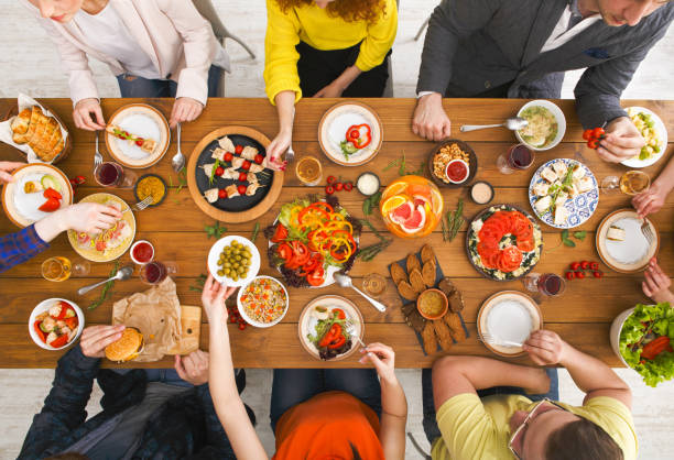 istock People eat healthy meals at served table dinner party 838178210