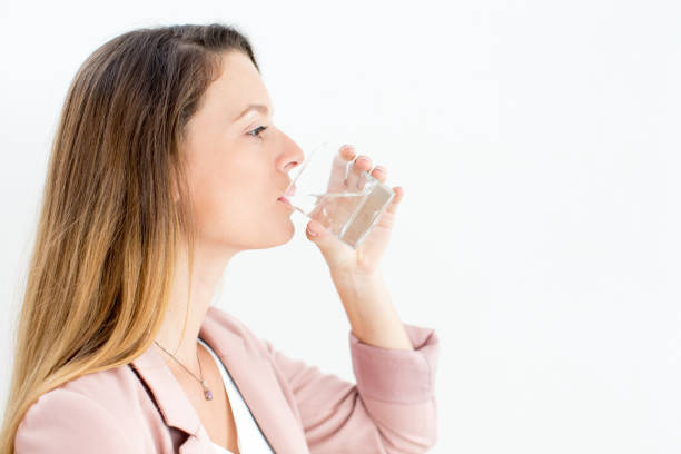 istock Confident young businesswoman drinking water 838181602