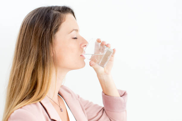 istock Young businesswoman enjoying drinking water 838181632