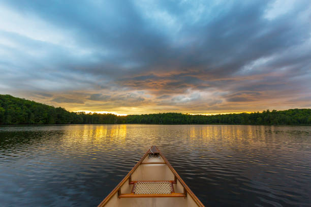 istock Canoe bow on a Canadian lake at sunset 838182066