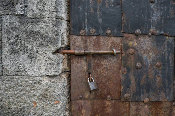 istock The old iron door of a stone building 838182386