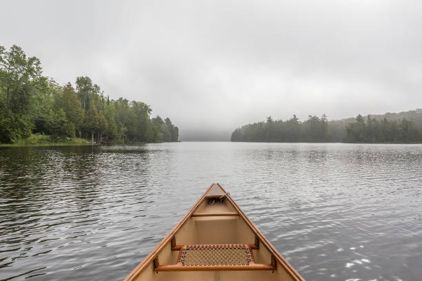 istock Canoe bow on a misty lake - Ontario, Canada 838182534
