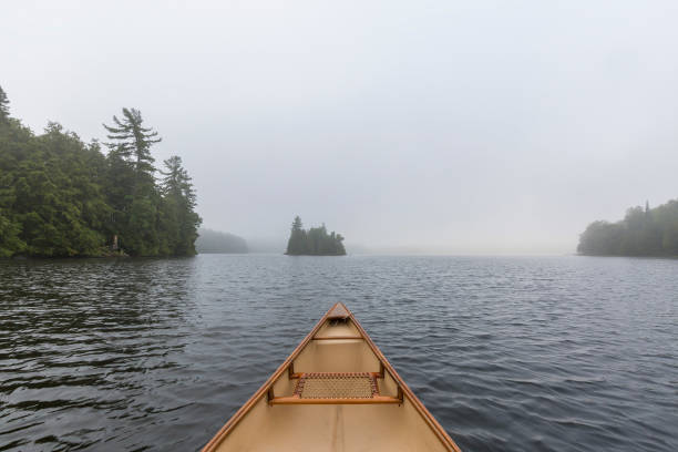 istock Canoe bow on a misty lake - Ontario, Canada 838185048