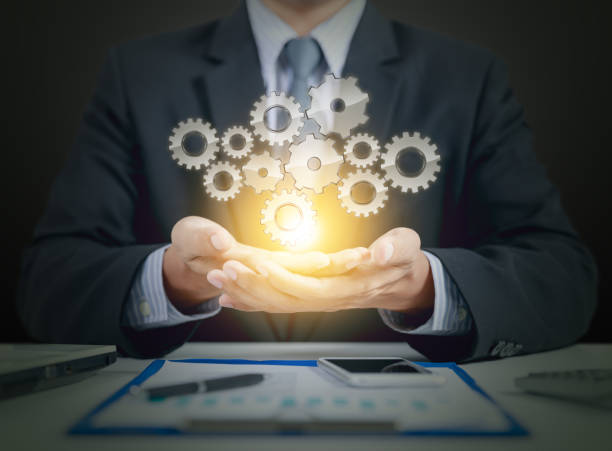 istock businessman present gear on hands, teamwork concept 838186412