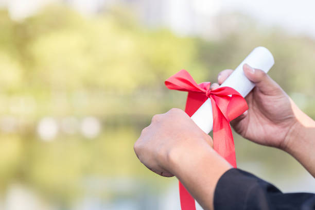 istock Graduate holding and touching certificated with feeling so proud 838193648