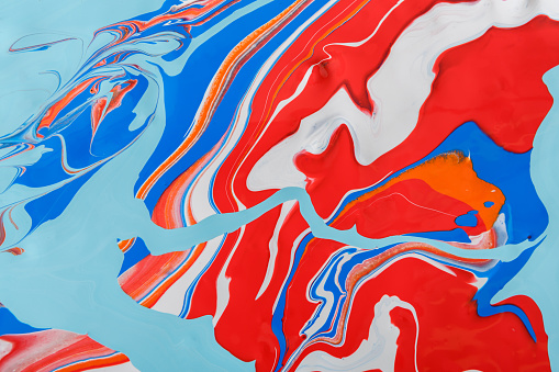 Liquid marbling paint background. Fluid painting abstract texture, blue and red. Intensive color mix