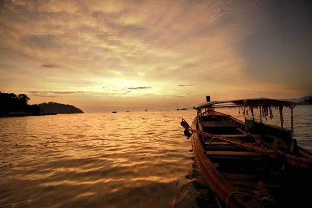 Sunset at Koh Lipe with Thai boat