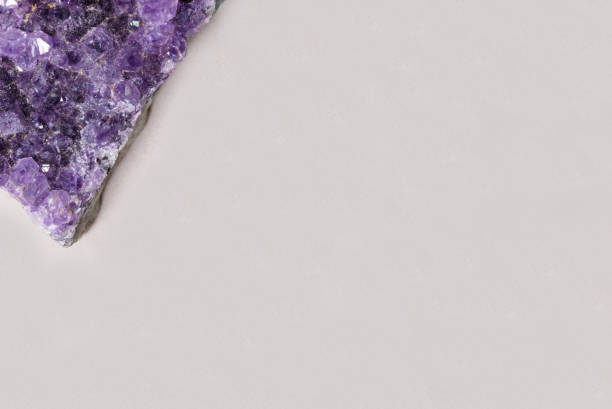 istock beautiful healing semiprecious violet amethyst gemstone on white background macro close up with copy space 838204266