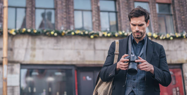 istock Handsome photographer in the city 838205392