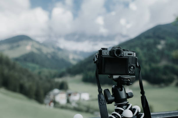 istock Digital camera on flexible portable tripod taking a landscape picture 838213684