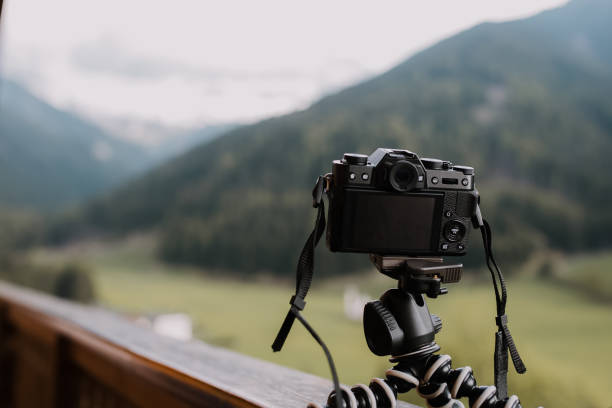 istock Digital camera on flexible portable tripod taking a landscape picture 838213858