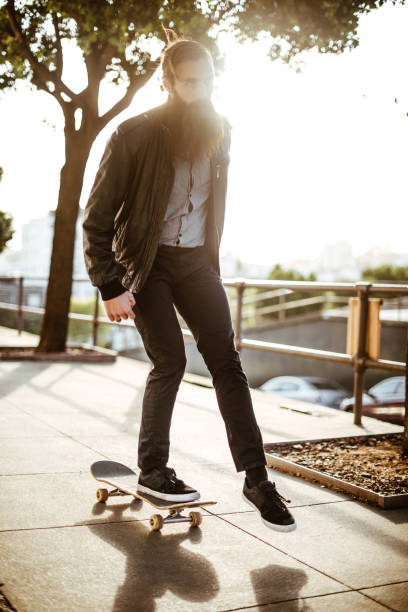 istock hipster with his skateboard on san francisco 838218034