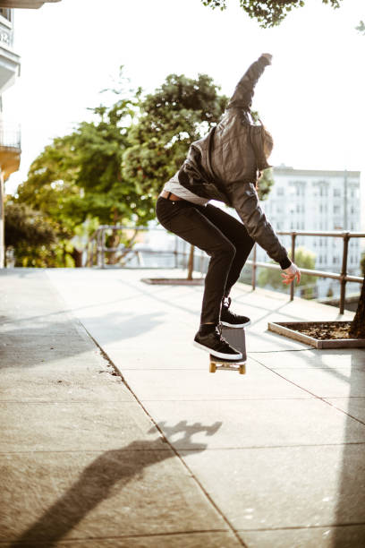 istock hipster with his skateboard on san francisco 838218388
