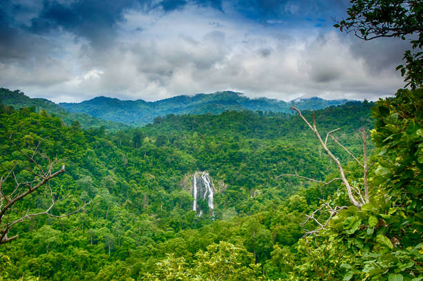 istock The most famous Khlonglan waterfall in deep forest top view in mountains with cloud and sky. 838218522