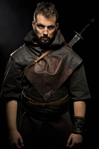 istock Viking warrior with sword over black background 838221170