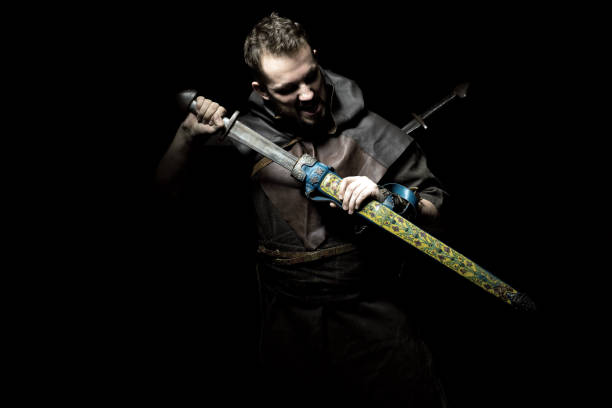 istock Viking warrior with sword over black background 838221312