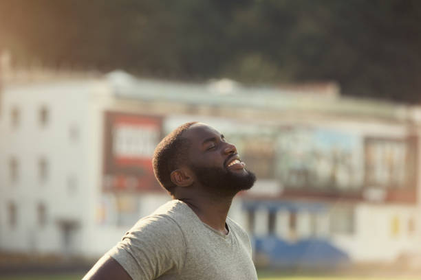 istock A handsome black man is feeling happy and relaxed, resting after workout in the field 838223266
