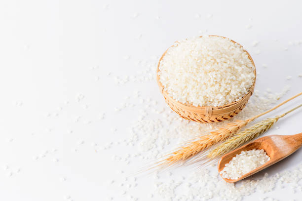 istock raw rice in a bamboo basket with wheat isolated on white   background 838233672