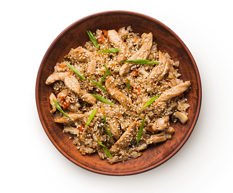 Asian food bowl isolated at white background. Teriyaki beef with rice, mushrooms, sesame and lemon grass. Japanese restaurant food delivery, top view