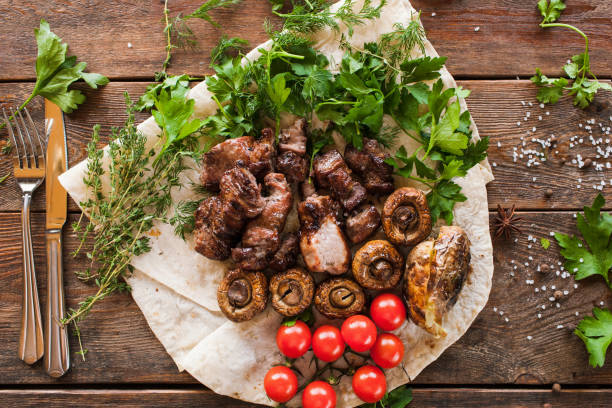 istock Shish-kebab with grilled vegetables on lavash 838233944