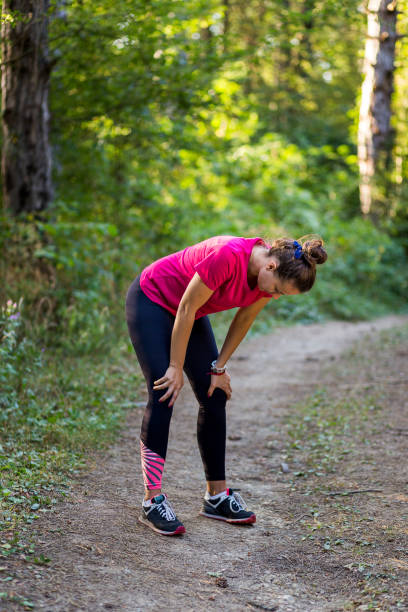 istock Female athlete resting in the forest after the workout 838238592