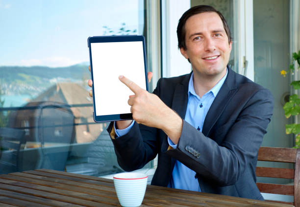 istock Businessman pointing at a Tablet Computer with his Finger 838241138