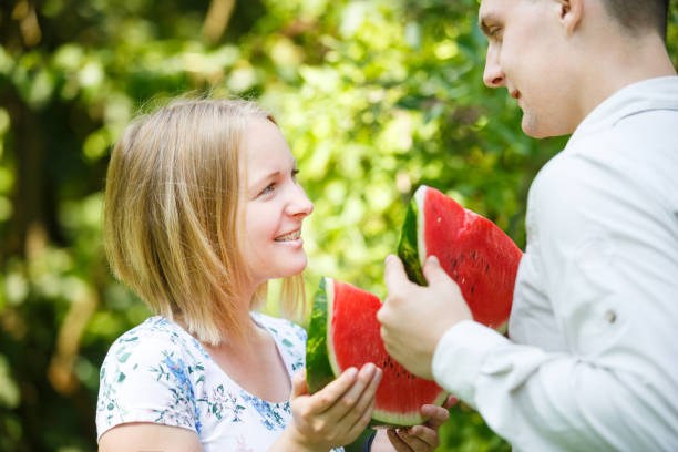 istock Couple is eating watermelon 838245834