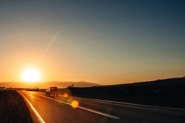 Death Valley Road Death Valley Roads at sunset warm sunset stock pictures, royalty-free photos & images