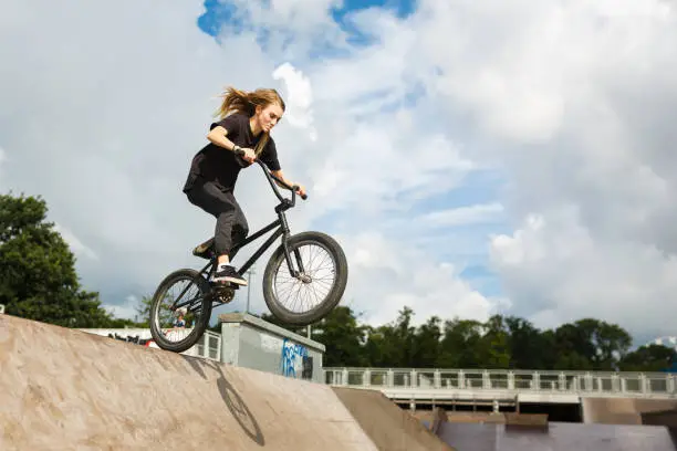 Photo of BMX rider over ramp