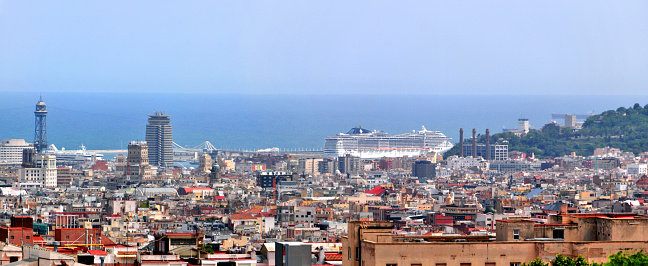 Barcelona, Catalonia: urban skyline - panorama of the port area with cruise ships and multiple logos present - photo by M.Torres