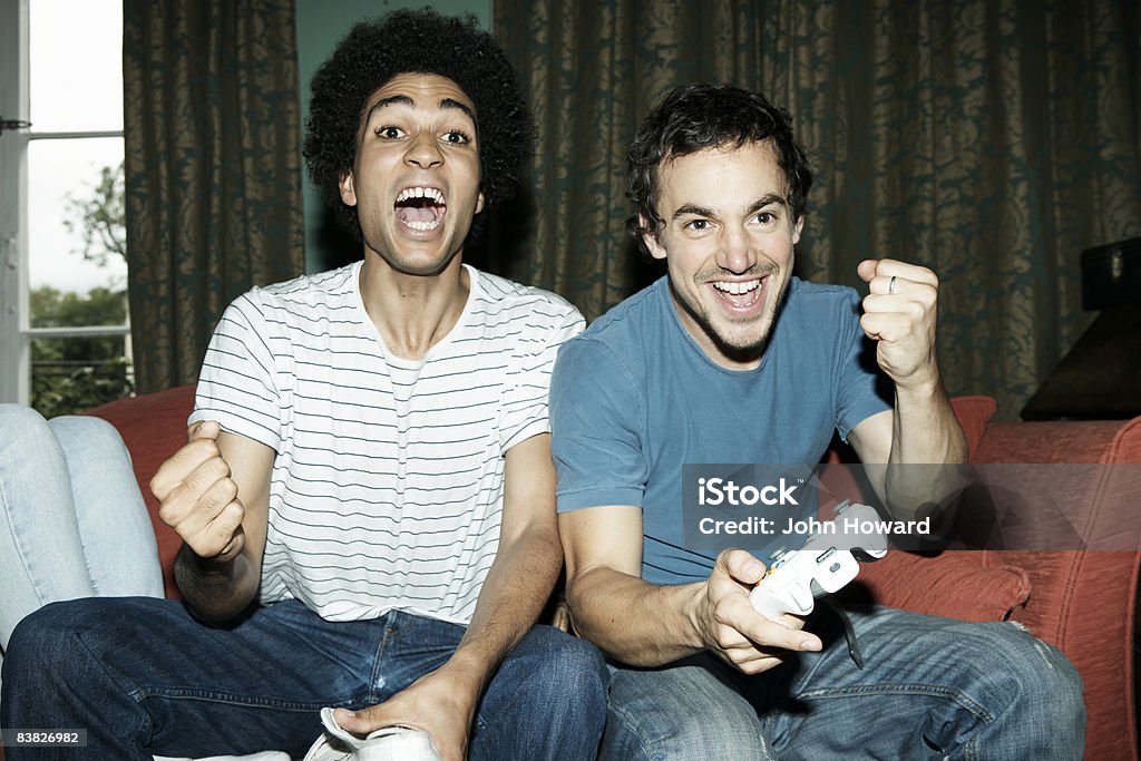 Friends playing video game  Video Game Stock Photo