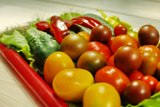 istock Assorted raw organic vegetables for healthy eating. Tomatoes, cucumbers, peppers and lettuce close up. 838274048