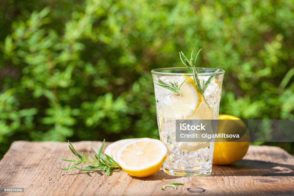 refreshing lemonade drink with rosemary in glasses Lemonade Stock Photo