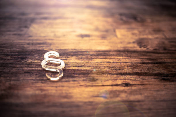 Paragraph symbol on wooden desk Paragraph symbol on wooden desk paragraph photos stock pictures, royalty-free photos & images