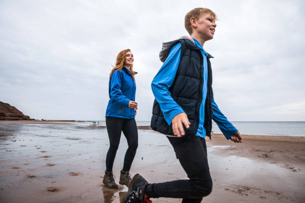 istock Brother and sister playing in a beach in Cornwall 838289828