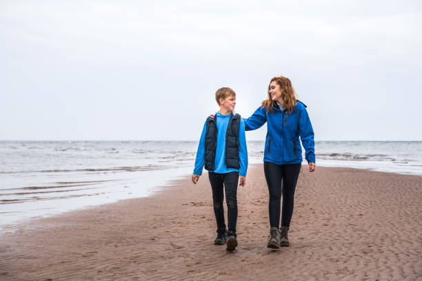 istock Brother and sister playing in a beach in Cornwall 838289900