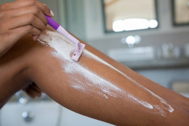 istock Low section of woman shaving leg 838303402