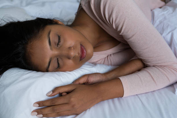 istock Young woman sleeping on bed 838303534