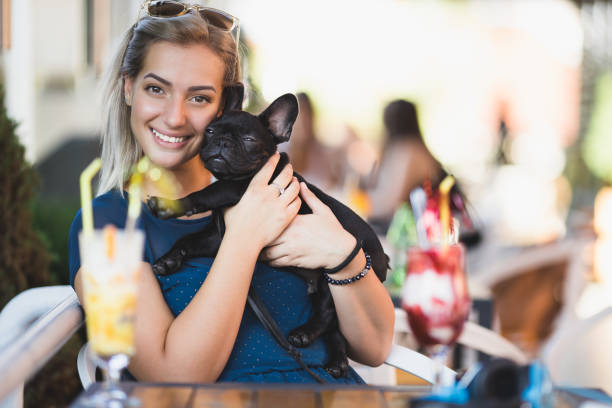 istock Woman with dog in cafe 838310144